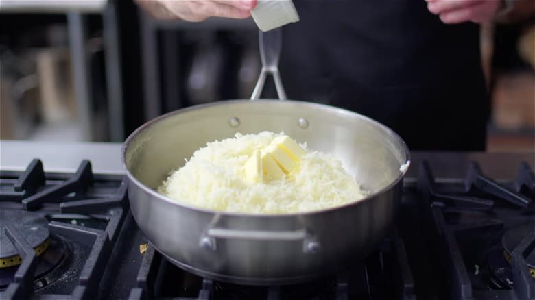 Butter being added to mash