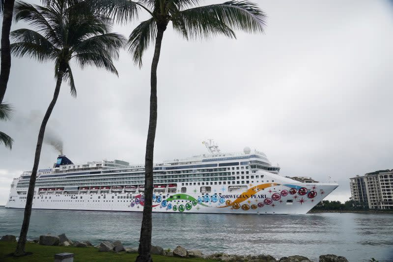 In this file image, the Norwegian Pearl cruise ship sails to PortMiami on Wednesday, Jan. 5, 2022, in Miami. (AP Photo/Marta Lavandier)