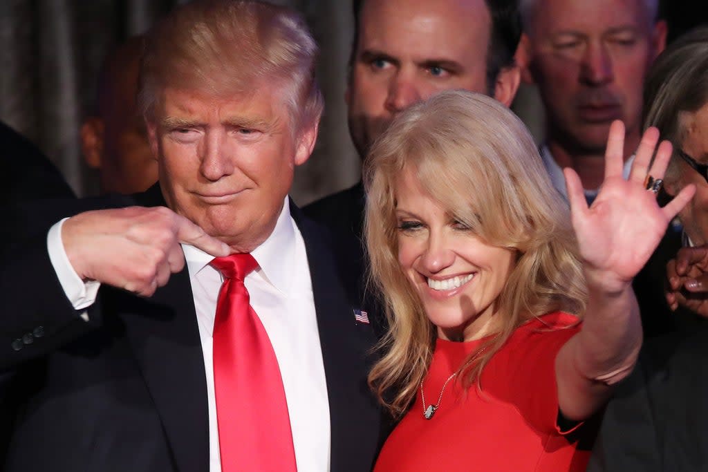 Republican president-elect Donald Trump along with his campaign manager Kellyanne Conway acknowledge the crowd during his election night event at the New York Hilton Midtown in the early morning hours of November 9, 2016 in New York City (Getty Images)