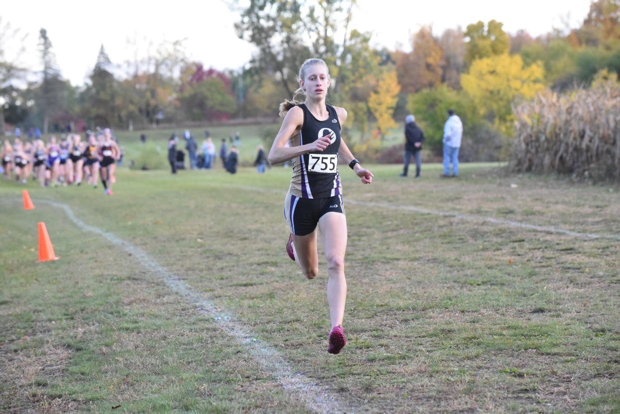 Onsted's Emmry Ross breaks away from the pack during the LCAA championships at Hudson.