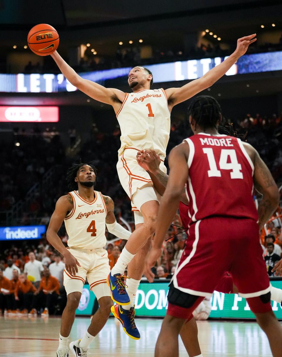 Texas forward Dylan Disu grabs a rebound during the Longhorns' 94-80 win over Oklahoma in the regular-season finale Saturday at Moody Center. The Longhorns may face Oklahoma against in their opening game at the Big 12 Tournament in Kansas City, Mo.