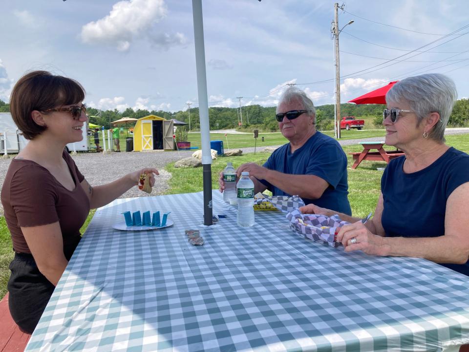 From left to right, Morgan Engels of Milwaukee and Russ and Pat Engels of Sussex, New Jersey enjoy lunch July 15, 2023 at West Coast Tacos 2.0 in Benson.