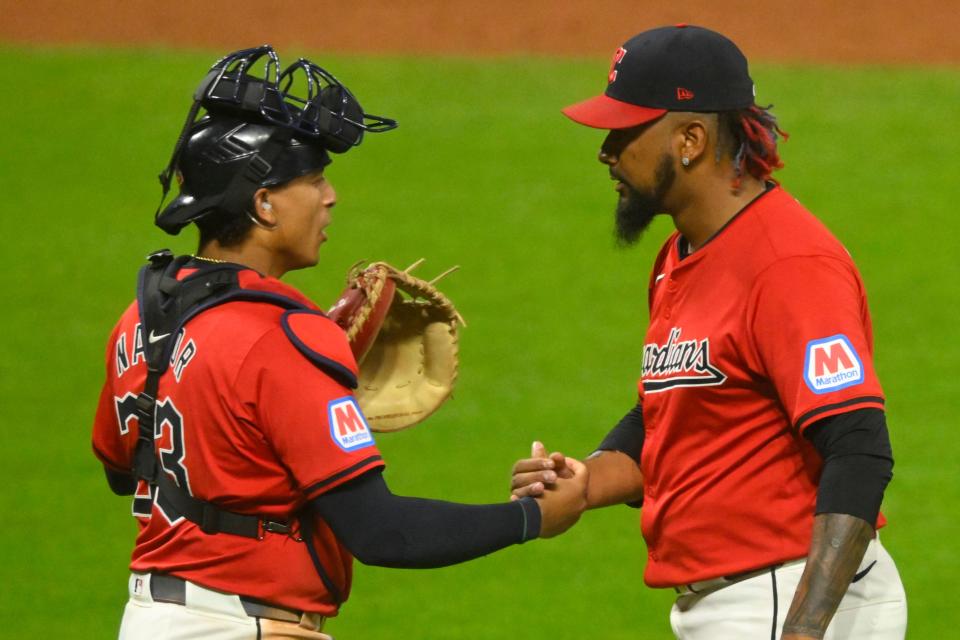 Sep 25, 2024; Cleveland, Ohio, USA; Cleveland Guardians catcher Bo Naylor (23) and relief pitcher Emmanuel Clase (48) celebrate a win over the Cincinnati Reds at Progressive Field. Mandatory Credit: David Richard-Imagn Images