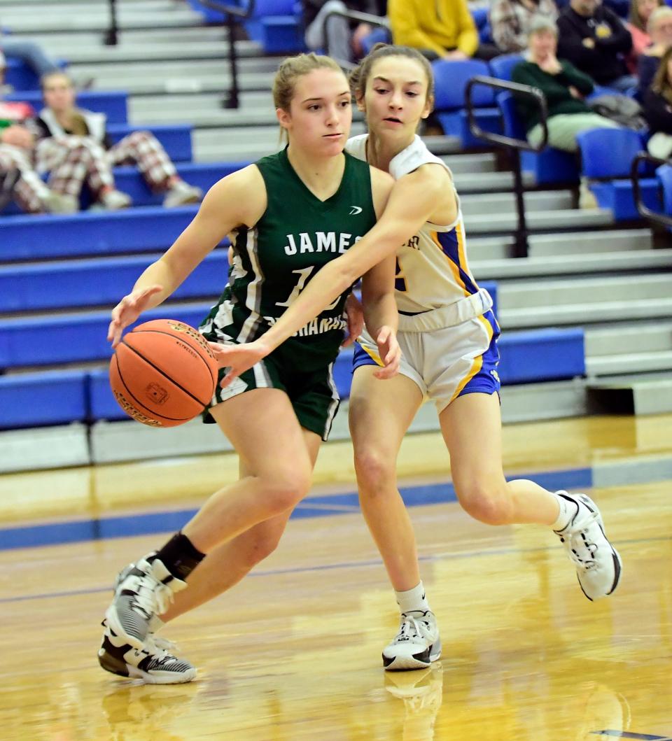 Sophia Stoner of James Buchanan drives against Waynesboro's Breanna Mcllquhan during a game this season. Stoner is a senior for the Rockets and the latest in a long line of Stoners to play basketball for JB.