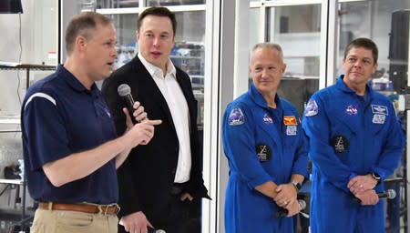 NASA Administrator Jim Bridenstine, SpaceX Chief Engineer Elon Musk, NASA astronauts Doug Hurley and Bob Behnken, take questions from the media after a tour of SpaceX headquarters in Hawthorne