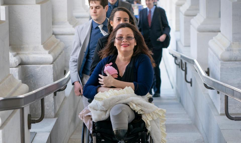 Sen. Tammy Duckworth, D-Ill., with her new daughter at the Capitol in Washington, D.C., on April 19, 2018.