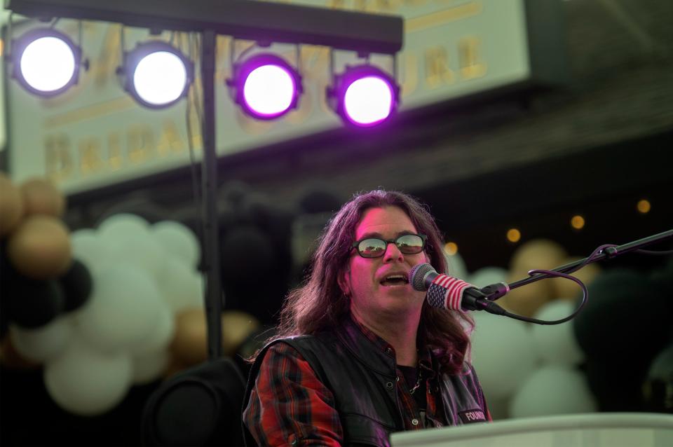 Ryan Bueter, one half of the duo known as the Killer Dueling Pianos, performs at the Brickwalk in Lincoln Center in Stockton on Oct. 15. The duo performed audience-requested crowd-pleasing pop songs in an interactive concert.