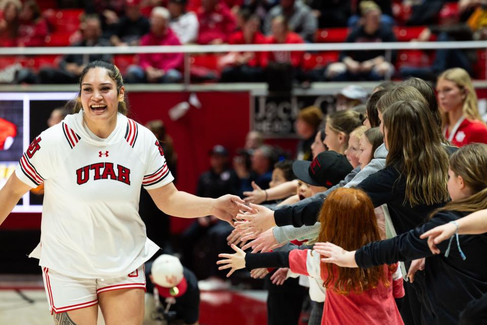 Utah Utes forward Alissa Pili (35) high-fives fans before the women’s college basketball game between the Utah Utes and the Oregon State Beavers at the Jon M. Huntsman Center in Salt Lake City on Friday, Feb. 9, 2024. | Megan Nielsen, Deseret News