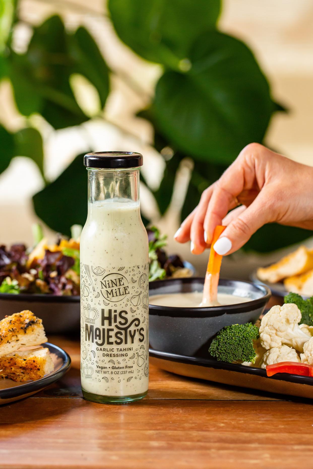Nine Mile restaurant has released two signature salad dressings for retail sale, Hollapeño Lime (Jalapeño Lime Cilantro) and His Majesty’s (Sesame Garlic Tahini).
