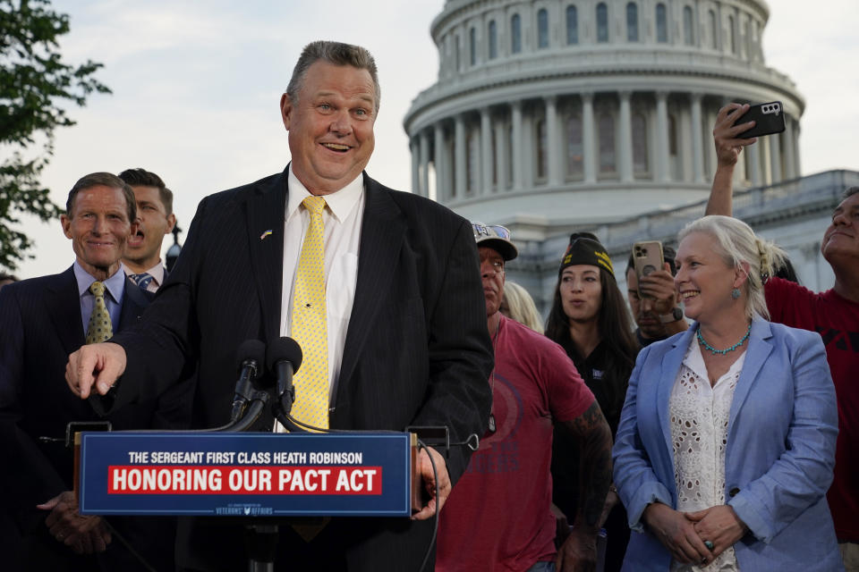 FILE - Sen. Jon Tester, D-Mont., speaks at a news conference alongside Sen. Richard Blumenthal, D-Conn., back left, and Sen. Kirsten Gillibrand, D-N.Y., after the Senate passed a bill designed to help millions of veterans exposed to toxic substances during their military service, Aug. 2, 2022, on Capitol Hill in Washington. (AP Photo/Patrick Semansky, File)