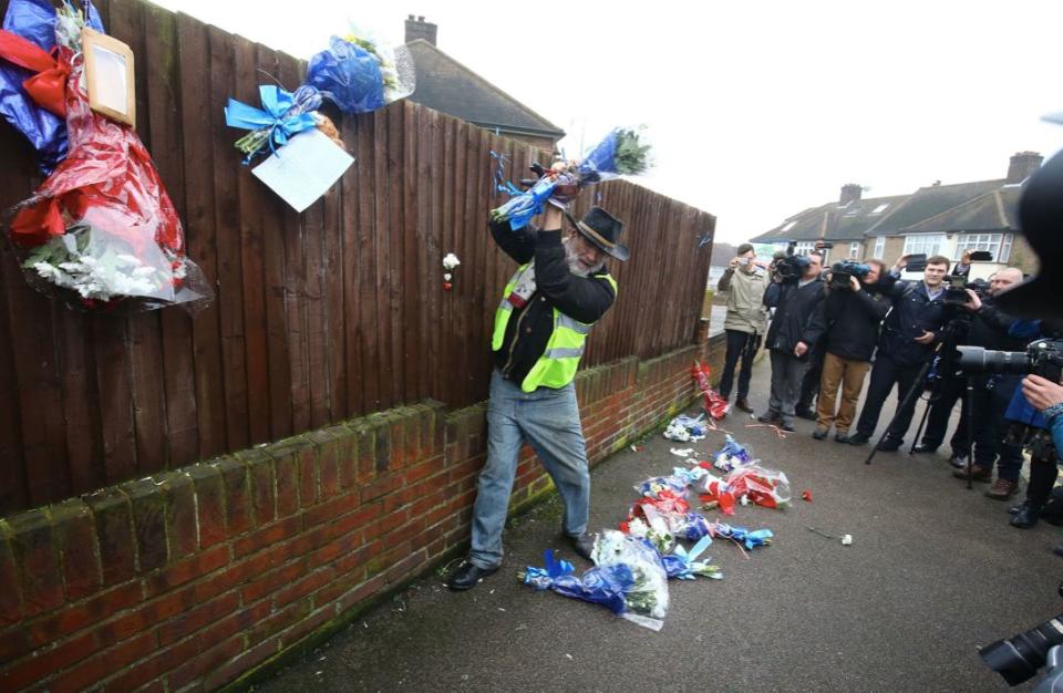 Locals pulled down tributes to Vincent placed up by mourners following his death  (PA)