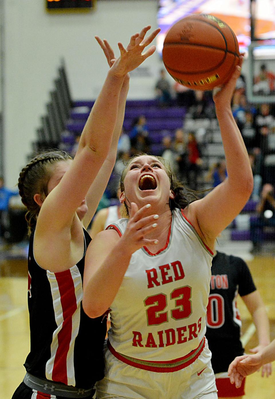 Wagner's Emma Yost (23) is fouled by Sisseton's Chloe Langager during their semifinal game in the state Class A high school girls basketball tournament on Friday, March 10, 2023 in the Watertown Civic Arena.
