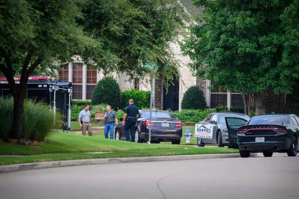 A view of members of the Allen police department and the FBI as they gather evidence from the home of Patrick Crusius in Allen, Texas. Crusius is the named suspect who allegedly killed 20 people in a mass shooting at a Walmart shopping center in El Paso, Texas.  Jerome Miron/USA TODAY