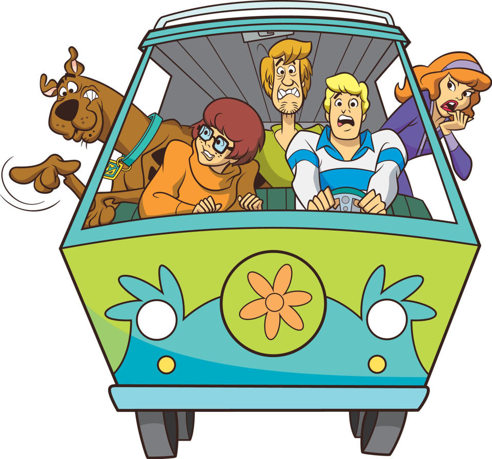 (Clockwise) Scooby-Doo, Shaggy, Daphne, Velma and Fred of Mystery Inc. in their Mystery machine vehicle for a "What's New, Scooby-Doo?" promotional photo
