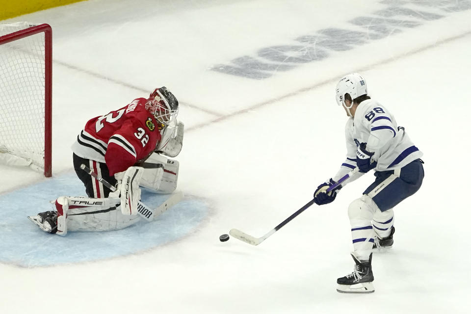 Toronto Maple Leafs' William Nylander (88) shoots and scores the game winning goal during an overtime period of an NHL hockey game Wednesday, Oct. 27, 2021, in Chicago. The Maple Leafs won 3-2. (AP Photo/Charles Rex Arbogast)