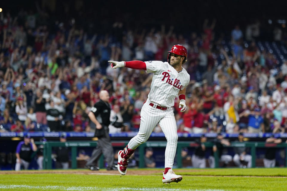 Philadelphia Phillies' Bryce Harper reacts after hitting a home run against Colorado Rockies pitcher Tyler Kinley during the seventh inning of a baseball game, Saturday, Sept. 11, 2021, in Philadelphia. (AP Photo/Matt Slocum)