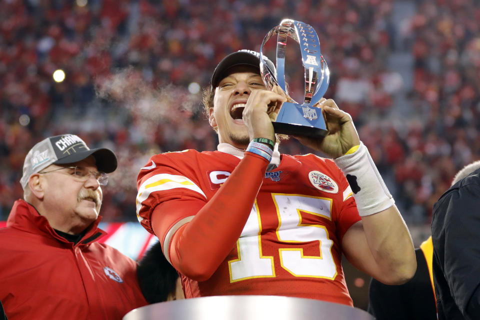 In this Jan. 19, 2020, photo, Kansas City Chiefs quarterback Patrick Mahomes holds the Lamar Hunt Trophy as he celebrates winning a NFL, AFC Championship football game against the Tennessee Titans in Kansas City, Mo. The most compelling dramas in the NFL this season unfolded on the field, not off of it. And any thought that the league was in jeopardy of losing its spot as America's favorite sport has been set on the back burner. (AP Photo/Colin E. Braley)