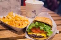 <p>Head to Madison Square Park in New York City, and you'll come across a <a href="https://www.shakeshack.com" rel="nofollow noopener" target="_blank" data-ylk="slk:small, metal snack shack;elm:context_link;itc:0;sec:content-canvas" class="link ">small, metal snack shack</a> that cooks up some of the most talked-about patties in all of Manhattan. Since it's burst of popularity in the early millennium, the business has expanded to 130 locations across North America and 70 internationally. The 100% all-natural angus beef patties are best served up in a traditional burger. However, if chicken or hot dogs strike your fancy, they have those, too. After all, Shake Shack did start as an NYC hot dog shack. Whatever you decide, don't forget to throw in a side of wavy fries with cheese sauce for a couple of bucks extra.</p>