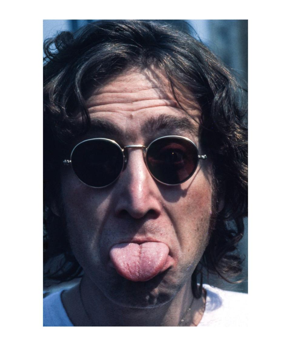 This photo of John Lennon in a playful moment is part of the exhibition.