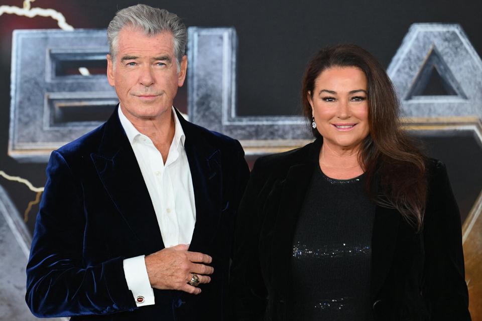 Irish Actor Pierce Brosnan (L) and his wife Keely Shaye Smith arrive for the premiere of "Black Adam" at Time Square in New York City on October 12, 2022.