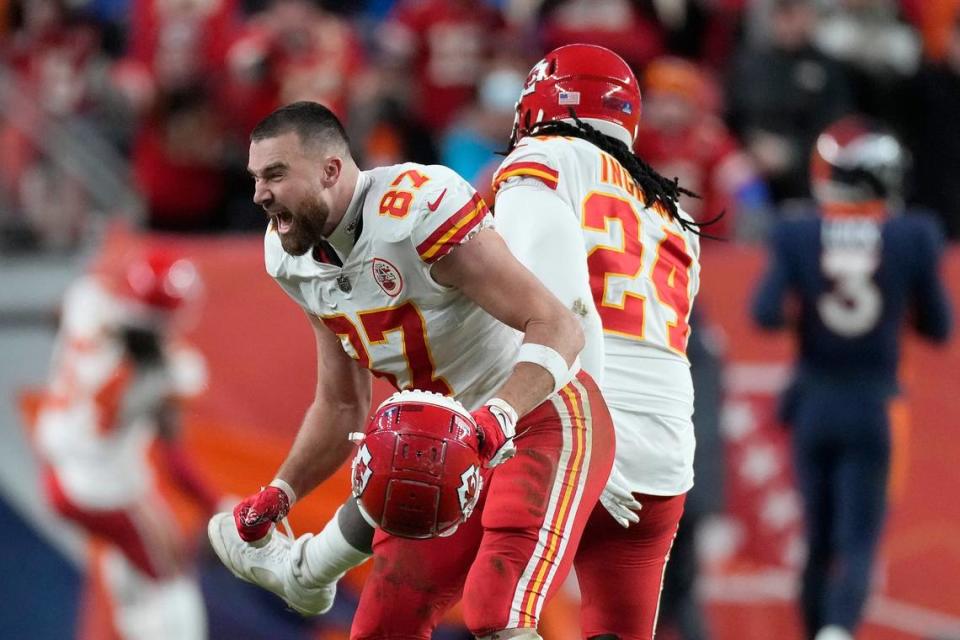 Chiefs tight end Travis Kelce, left, celebrates with linebacker Melvin Ingram (No. 24) after Nick Bolton scored on the fumble Ingram had just forced from Broncos running back Melvin Gordon on Saturday in Denver.