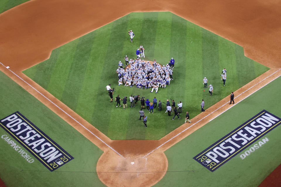 ARLINGTON, TEXAS - OCTOBER 18:  The Los Angeles Dodgers pose for a photo following their 4-3 victory against the Atlanta Braves in Game Seven of the National League Championship Series at Globe Life Field on October 18, 2020 in Arlington, Texas. (Photo by Ronald Martinez/Getty Images)