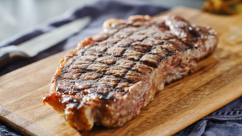 Steak resting on cutting board 