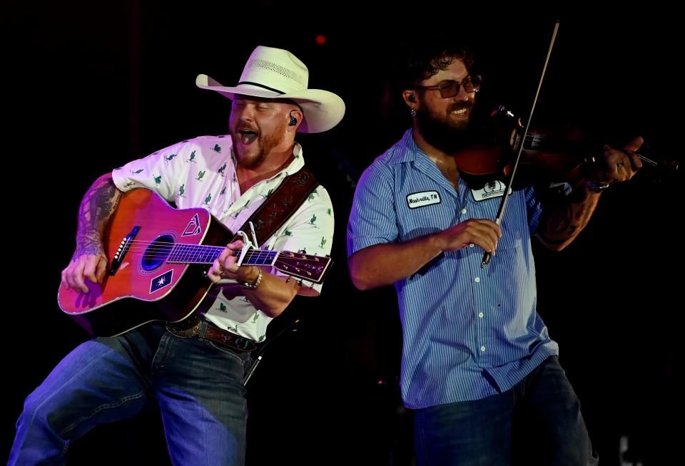 Cody Johnson performs with fiddle player Jody Bartula at the Firstbank Amphitheater on Thursday, July 28, 2022, in Franklin, Tenn. 