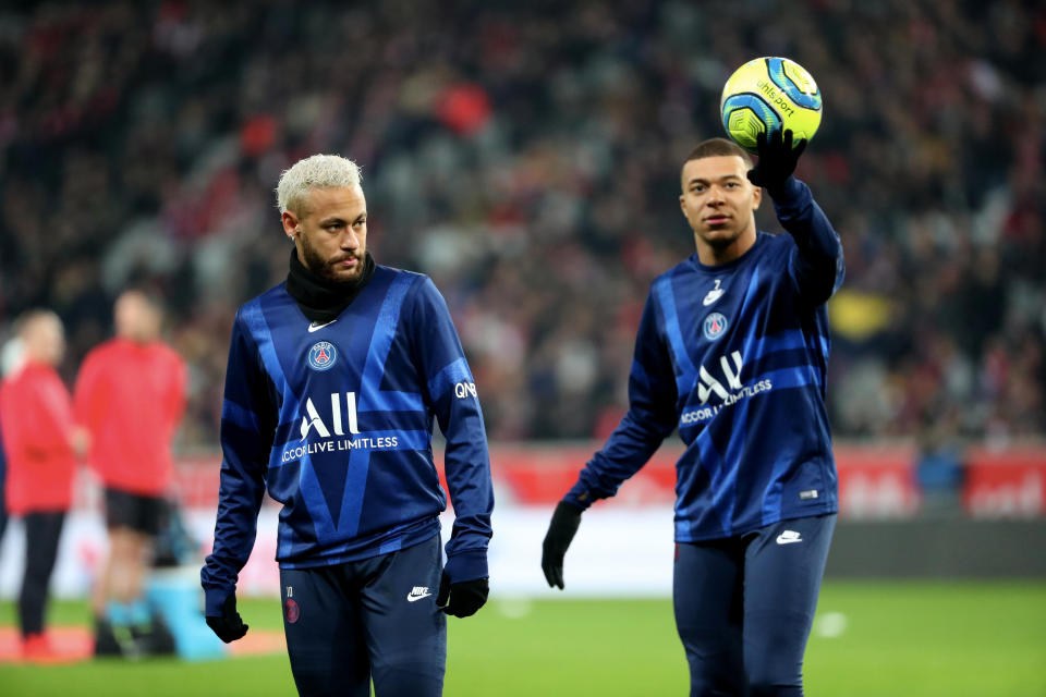 Neymar (left), Kylian Mbappe and Paris Saint-Germain won't be able to finish the season along with the rest of Ligue 1. (Photo by Xavier Laine/Getty Images)