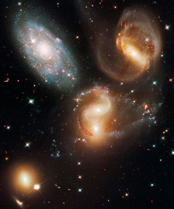 A Hubble image of Stephen's Quintet, a group of five large galaxies in the constellation Pegasus. Four of the galaxies are gravitationally interacting while the fifth, at lower left, is not involved. / Credit: NASA, ESA, Hubble Legacy Archive
