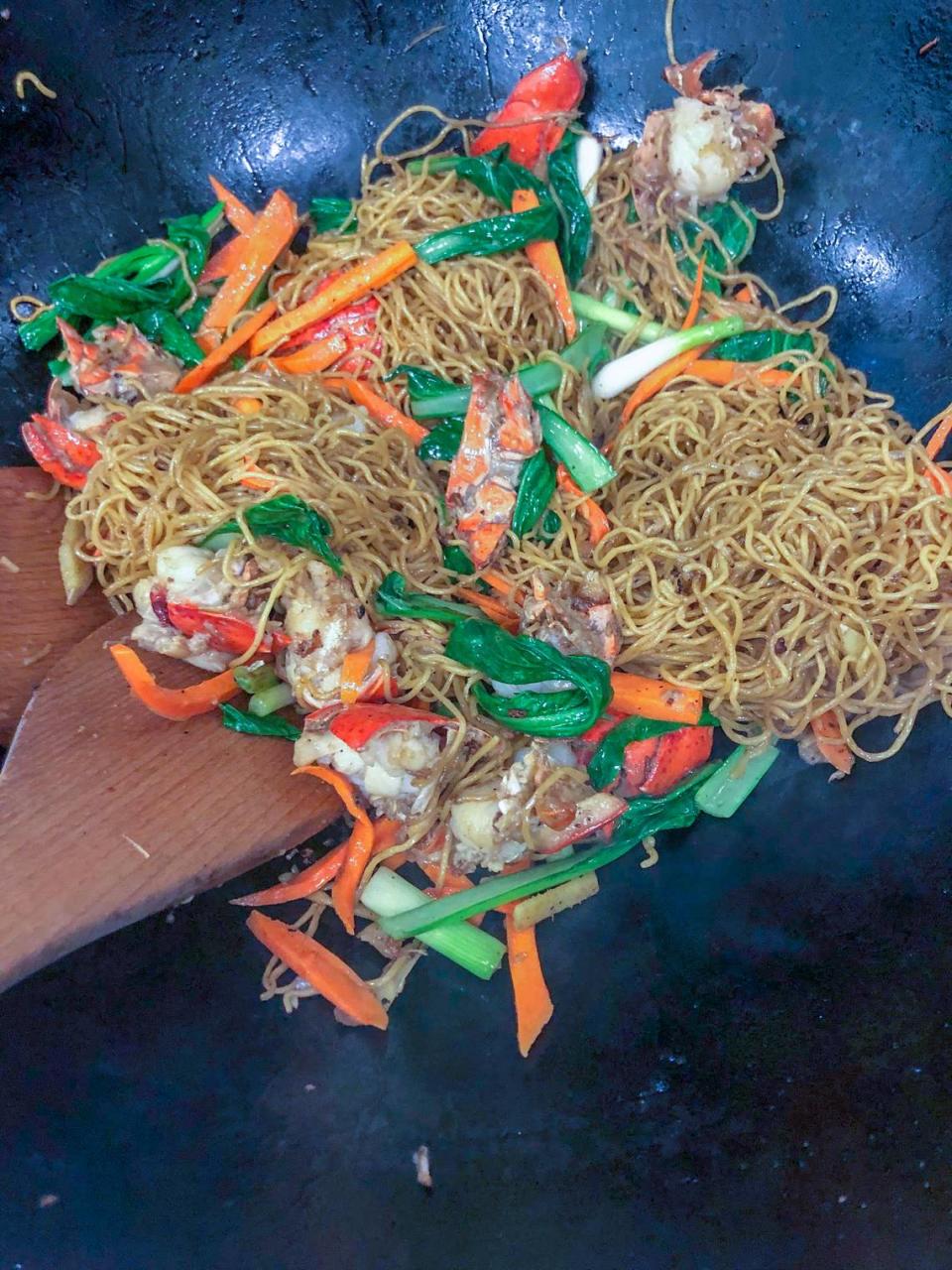 Not in the mood for pho? Dive into stir-fry egg noodle with veggies and lobster.