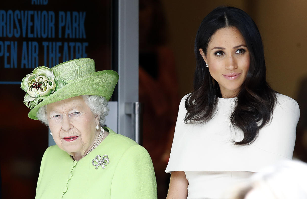 Queen Elizabeth II and the Duchess of Sussex arrive to visit Storyhouse Chester, where they will be taken on a tour of the building before unveiling a plaque to mark the official opening. (Photo by Martin Rickett/PA Images via Getty Images)