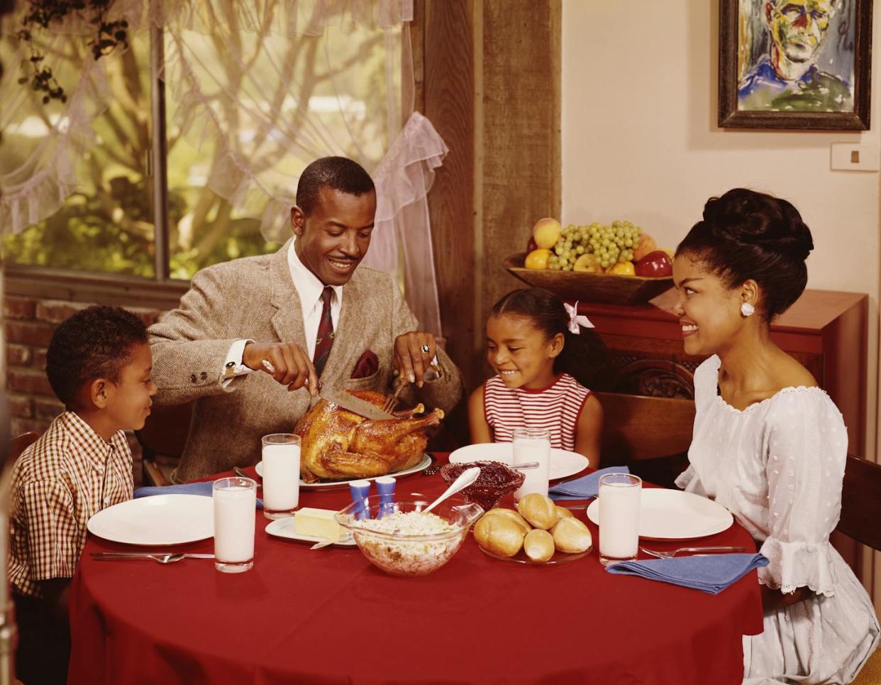 Many pundits in the manosphere believe that men need to embrace their traditional roles as protectors, providers and producers. <a href="https://www.gettyimages.com/detail/news-photo/father-carves-the-roast-chicken-during-a-family-meal-with-news-photo/73534034?adppopup=true" rel="nofollow noopener" target="_blank" data-ylk="slk:L. Willinger/FPG via Getty Images;elm:context_link;itc:0;sec:content-canvas" class="link ">L. Willinger/FPG via Getty Images</a>