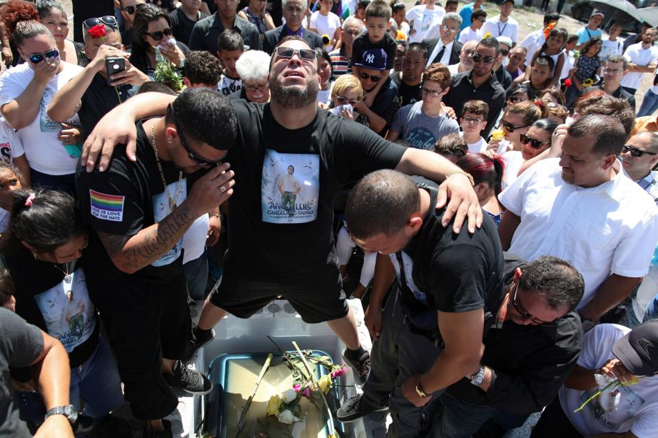 <p>Family and friends attend the funeral of Angel Candelario, one of the victims of the shooting at the Pulse night club in Orlando, Fla., at his hometown of Guanica, Puerto Rico, June 18, 2016. (Reuters/Alvin Baez) </p>