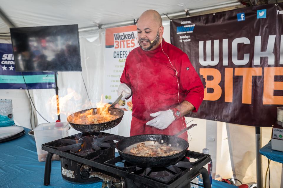 Danny Garcia, of Eva's Pastries in Peabody, Mass., prepares his famous Spicy Shrimp at 34th Hampton Beach Seafood Festival on Saturday Sept. 9, 2023.