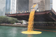 <p>Rubber ducks are dropped into the Chicago River to start the Windy City Rubber Ducky Derby on August 3, 2017 in Chicago, Illinois. (Photo: Scott Olson/Getty Images) </p>