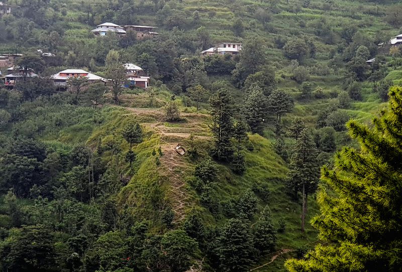 View of the suspended chairlift a day after rescuers pulled seven children and one man to safety when it became stranded high over a remote ravine, in Battagram