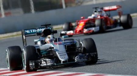 Formula One - Barcelona tests - Barcelona-Catalunya racetrack, Montmelo, Barcelona, Spain - 4/3/16.Mercedes F1 driver Lewis Hamilton is followed by Ferrari's Sebastian Vettel. REUTERS/Albert Gea