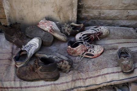 Blood stained shoes are pictured after Syrian government forces fired missiles on a busy marketplace in the Douma neighborhood of Damascus, Syria October 30, 2015. REUTERS/Bassam Khabieh