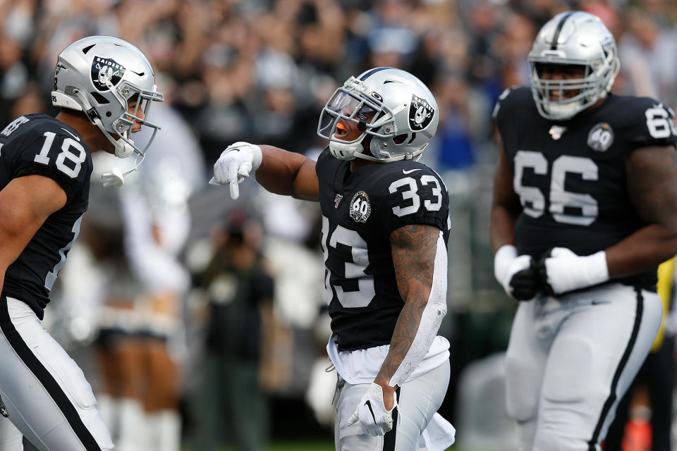 OAKLAND, CALIFORNIA - DECEMBER 08: DeAndre Washington #33 of the Oakland Raiders celebrates after scoring a touchdown in the first quarter against the Tennessee Titans at RingCentral Coliseum on December 08, 2019 in Oakland, California. (Photo by Lachlan Cunningham/Getty Images)