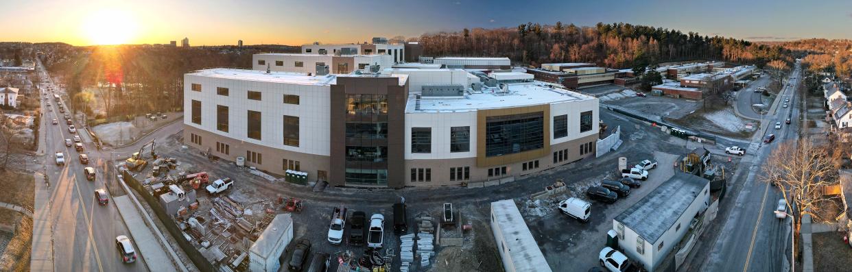 Worcester's new Doherty High School, left, will open in the fall. The existing school is shown at right.