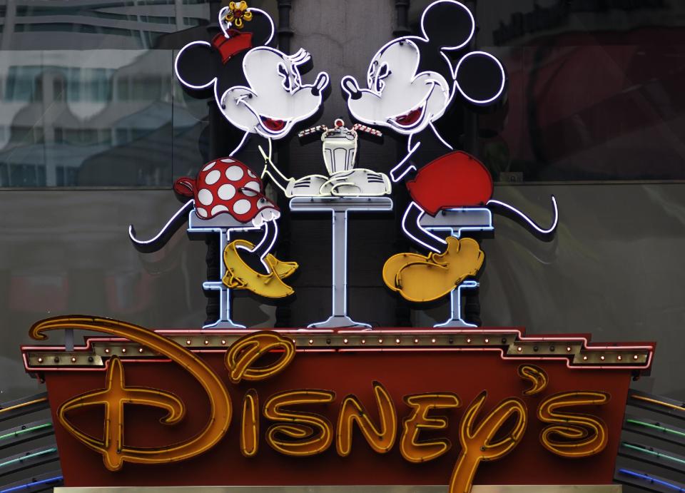 FILE-In this photo Feb. 6, 2012, file photo, the Disney Soda Fountain & Studio Store marquee is seen on Hollywood Boulevard in Los Angeles. The Walt Disney Co. said Tuesday, June 5, 2012, its programming will no longer be sponsored by junk food, becoming the first major media company to ban such ads for its TV channels, radio stations and websites intended for children. (AP Photo/Damian Dovarganes)