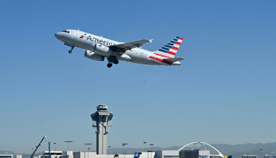 An American Airlines plane takes off from the Los Angeles International Airport.