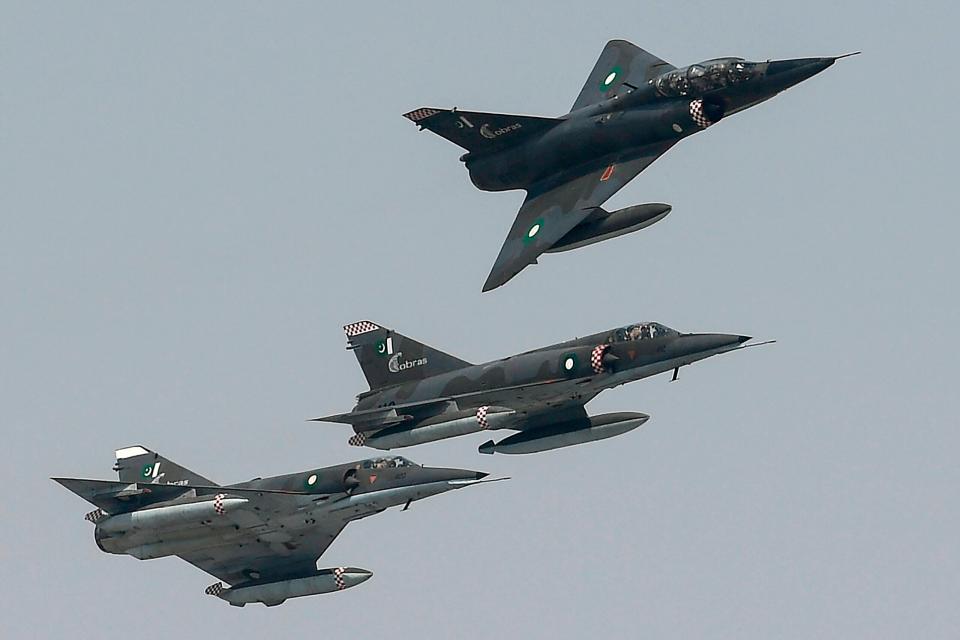 Pakistan Air Force Mirages perform a flypast during a ceremony marking the 50th anniversary of the induction of the French-made aircraft in its inventory, on February 25, 2021. <em>Photo by AAMIR QURESHI/AFP via Getty Images</em>