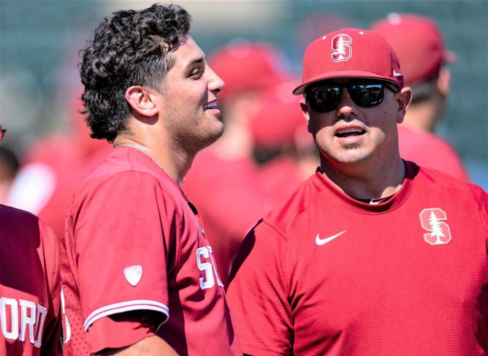 STANFORD, CA - MAY 14: Ryan Bruno, Thomas Eager chat during a game between University of Arizona and Stanford Baseball at Sunken Diamond on May 14, 2023 in Stanford, California.