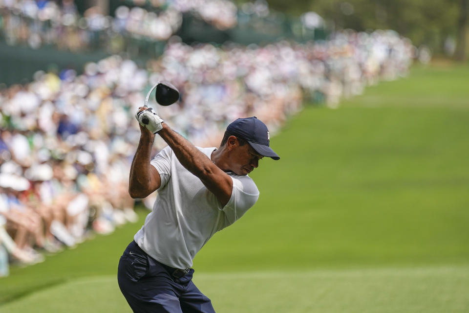 Tiger Woods hits his tee shot on the 14th hole during the first round of the Masters golf tournament at Augusta National Golf Club on Thursday, April 6, 2023, in Augusta, Ga. (AP Photo/David J. Phillip)