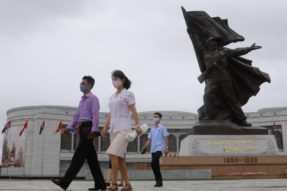 People visit the Victorious Fatherland Liberation War Museum to lay flowers on the occasion of the 67th anniversary of the end of the Korean War, which the country celebrates as the day of "victory in the fatherland liberation war" in Pyongyang, Monday, July 27, 2020. (AP Photo/Jon Chol Jin)