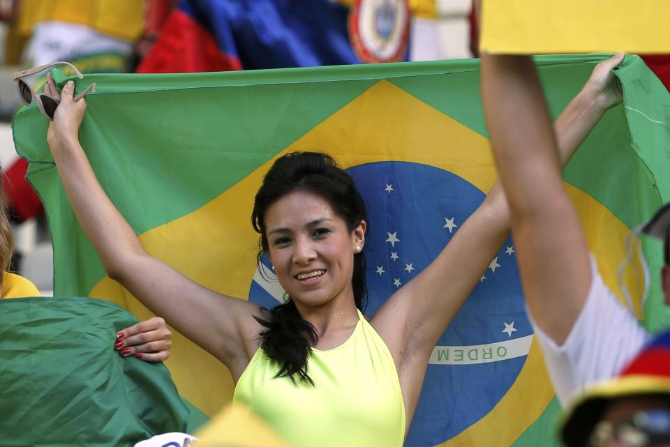 A Brazil fan cheers before the 2014 World Cup quarter-finals between Brazil and Colombia at the Castelao arena in Fortaleza July 4, 2014. REUTERS/Jorge Silva