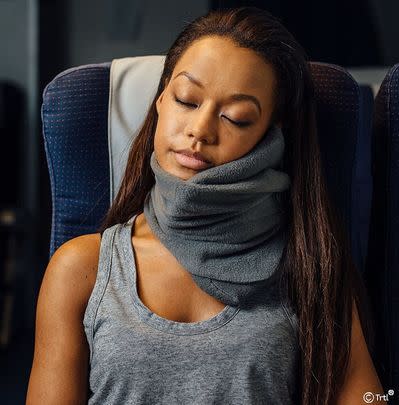 An ergonomic travel neck pillow