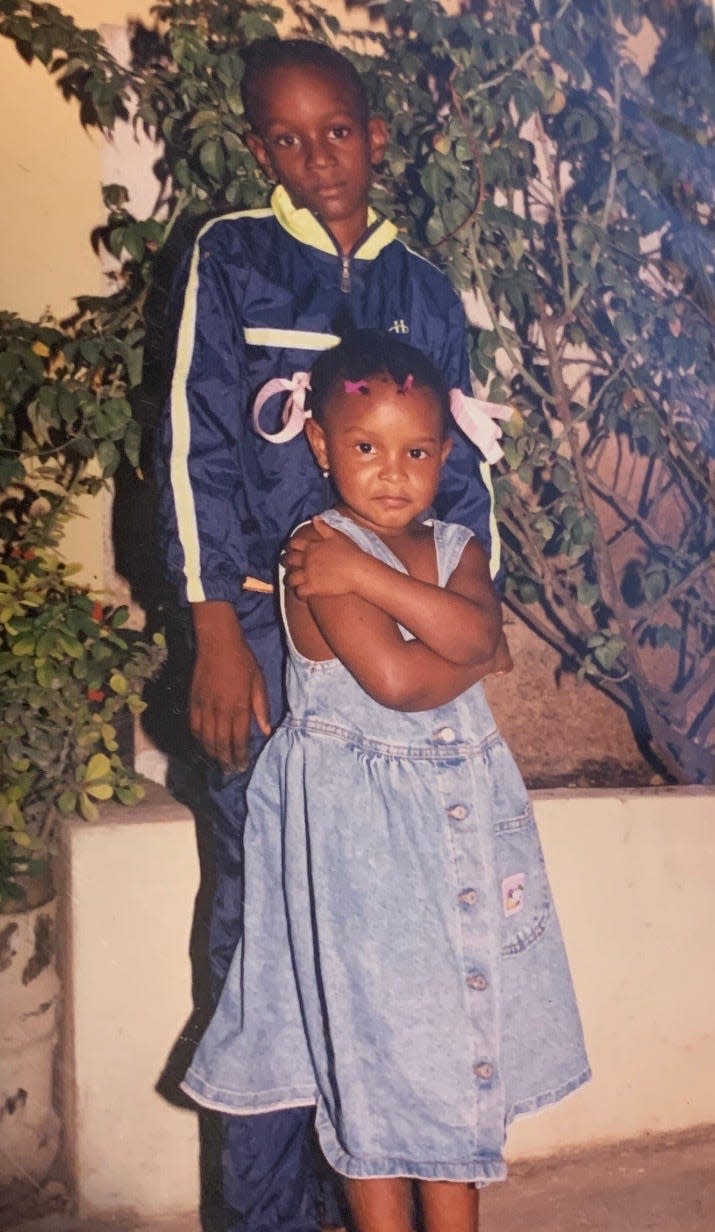 Alisha Saint-Ciel and her older cousin Carl Joseph photographed in their childhood home in Port-au-Prince, Haiti. Saint-Ciel spent a good chunk of her childhood in the tropical island living off the land with her family who also owns a farm in Chantal Haiti.